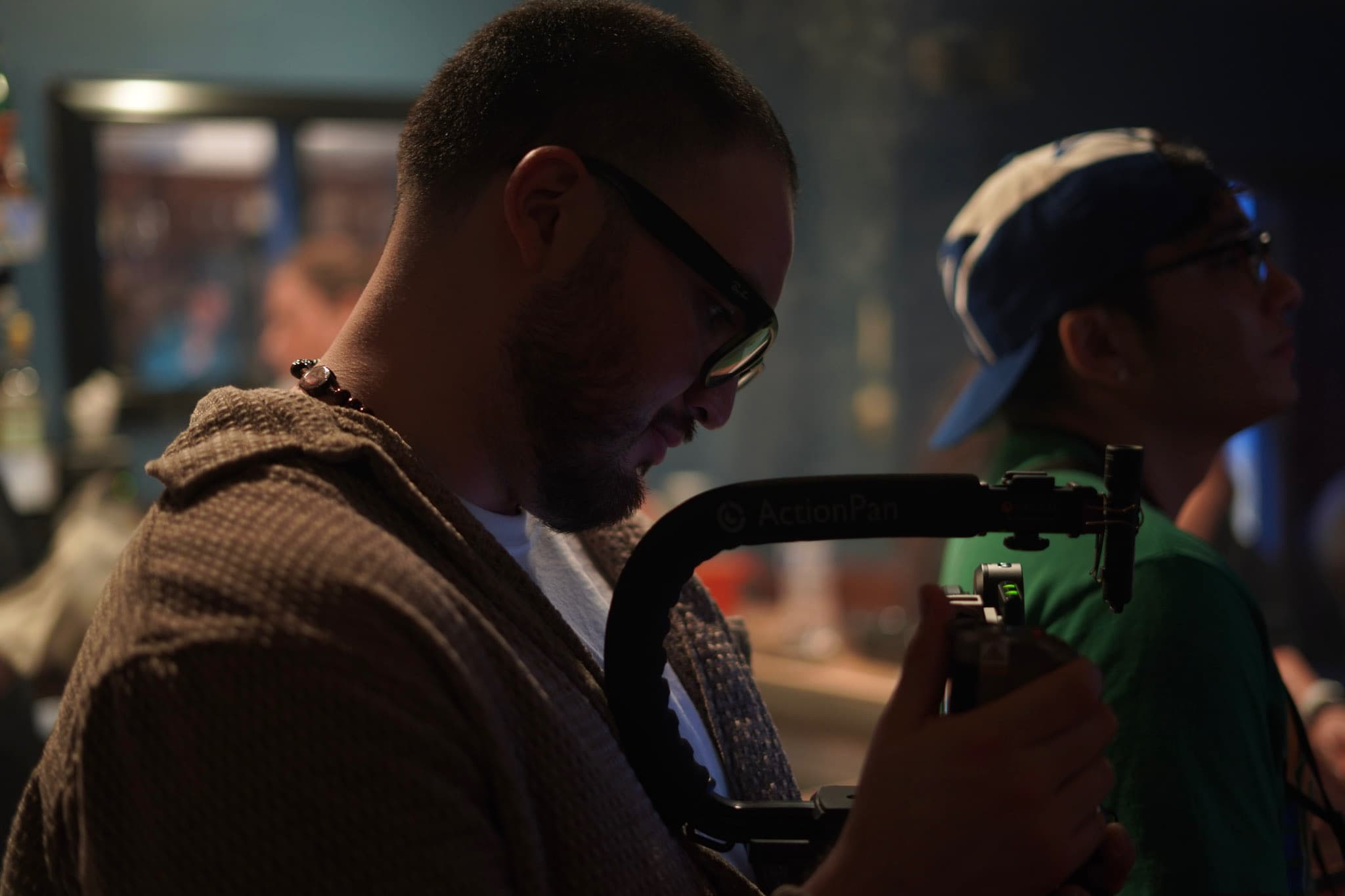 Behind the scenes filming a set with a camera rig